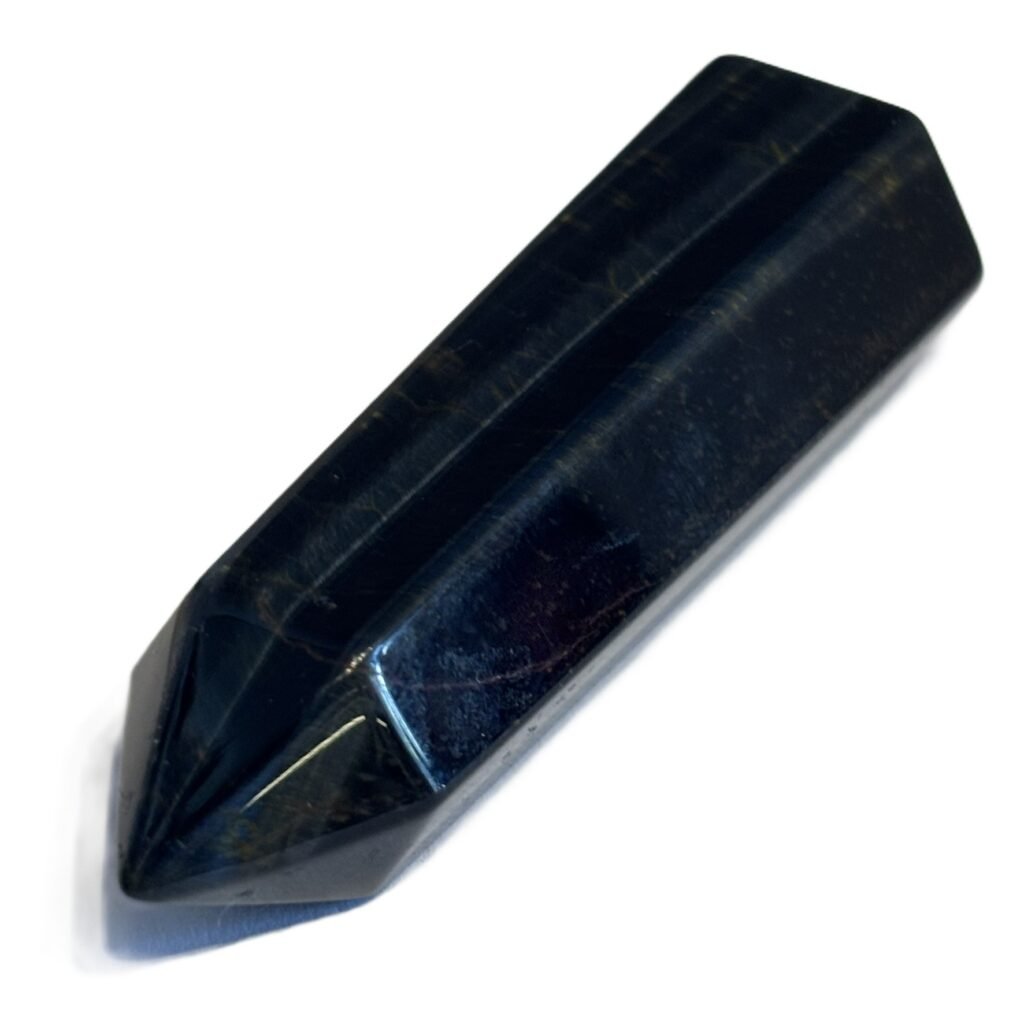 Blue tigers eye 11 2 sians emporium Polished blue tigers eye crystal point standing tower showing dark blue chatoyant bands on a white background